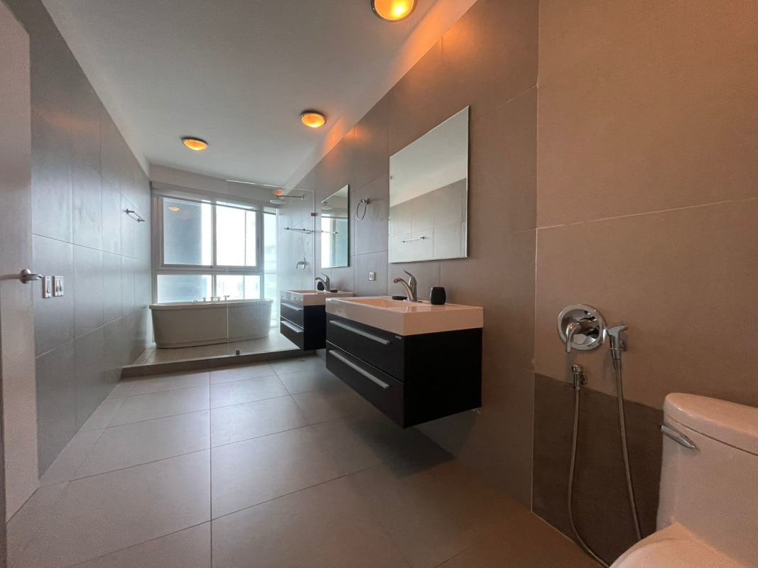 Modern open-concept living room with marina and ocean views in Yacht Club Tower Panama