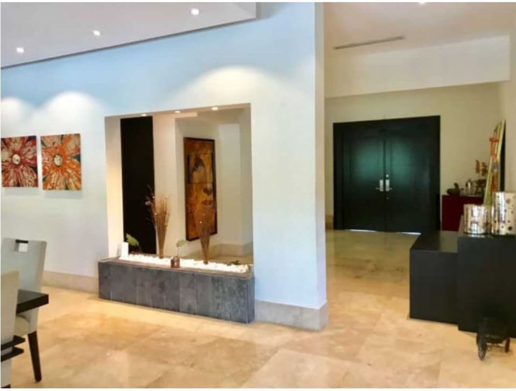 Kitchen with granite countertops, wood cabinetry, stainless appliances, large windows Toscana Estate Panama