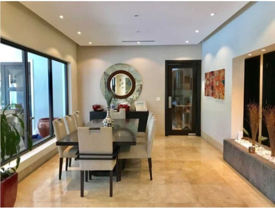 Elegant foyer with double doors and modern decor in luxury home at Toscana Costa del Este Panama