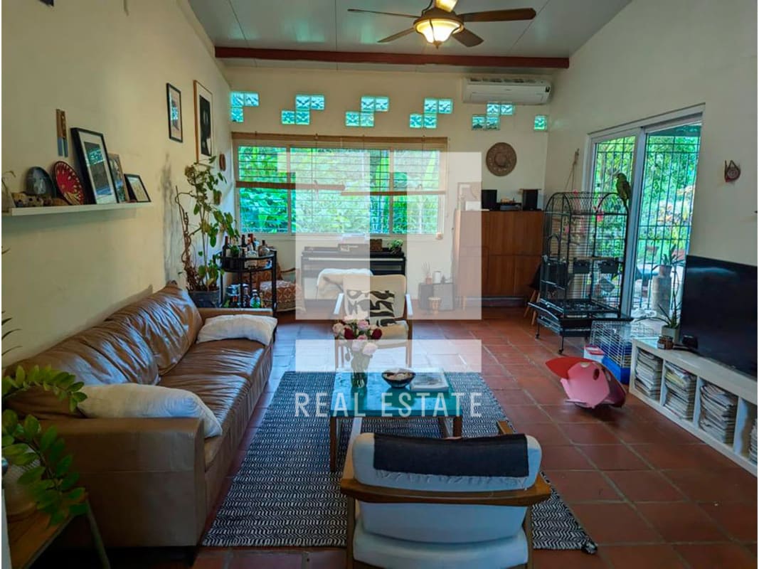 Open plan living dining room, rustic tiles, large windows, Diablo Ancon Panama