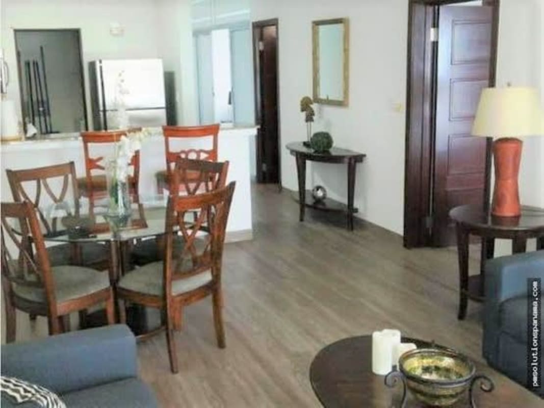 Bright living and dining area with access to balcony, ocean views, wood floors, PH Grandbay Panama