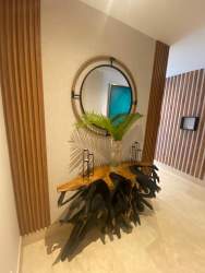 Chic entry hall with console table, round mirror, stylish decor Marina Village Buenaventura Panama