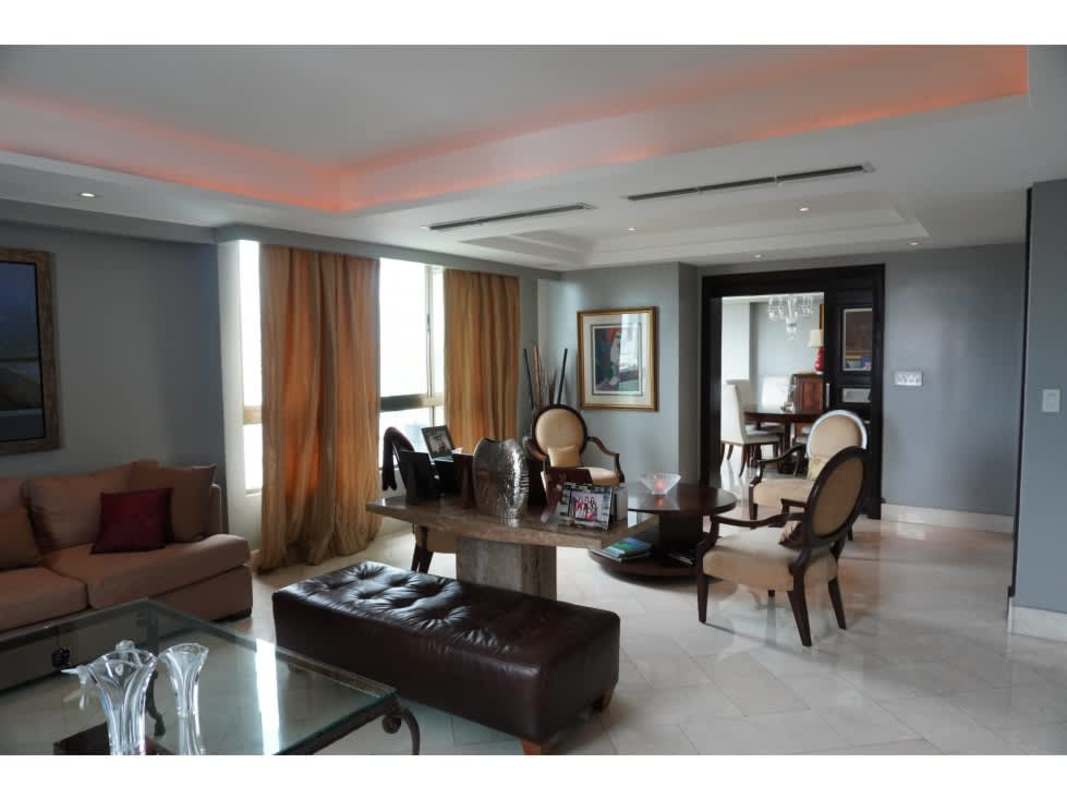 Modern dining room with marble floor and large panoramic golf course facing windows in PH Golf Tower Altos del Golf Panama