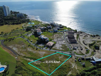 Aerial ocean view over Casamar community with outlined 2,370m2 residential development lot in San Carlos Panama