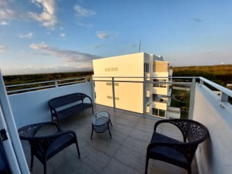 Living area with balcony access in Playa Blanca Coral Park apartment