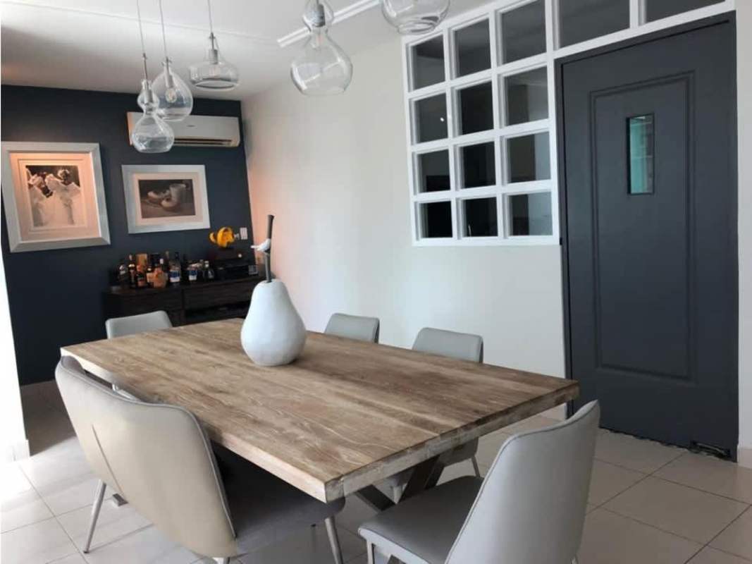 Modern master bedroom with large window and ocean view in PH Tao Panama City