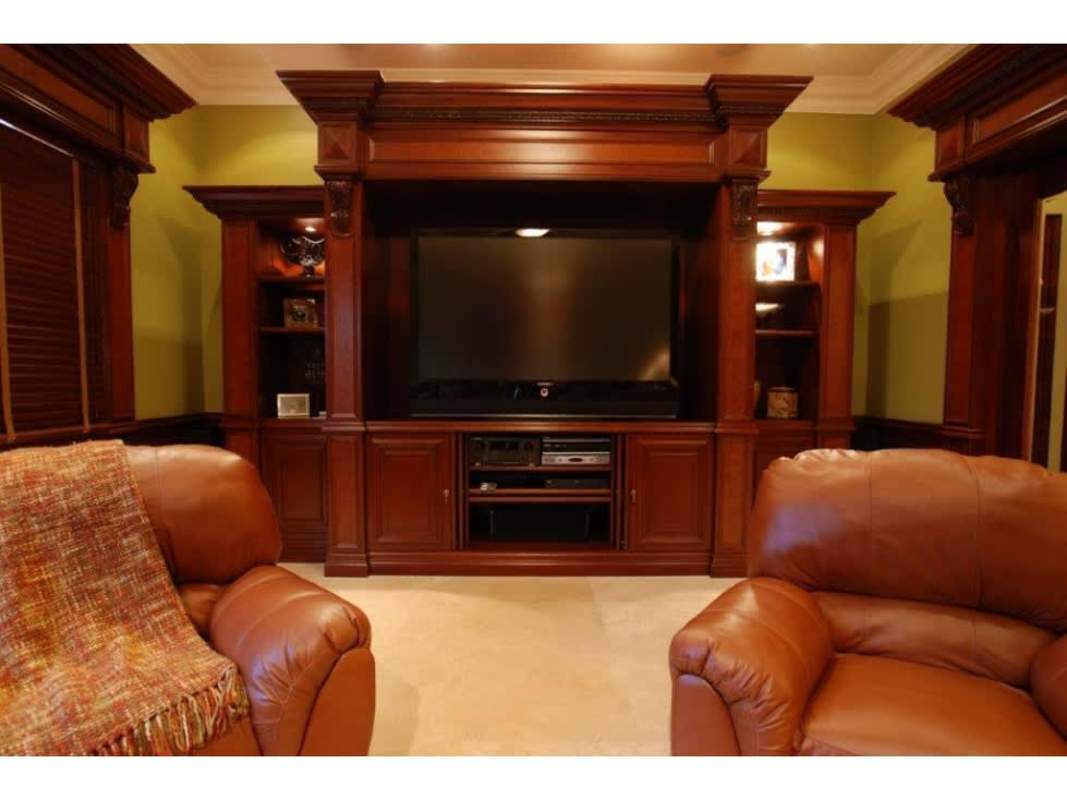 Traditional luxury living room with gold sofas, artwork, orange curtains in Camelias Costa del Este house