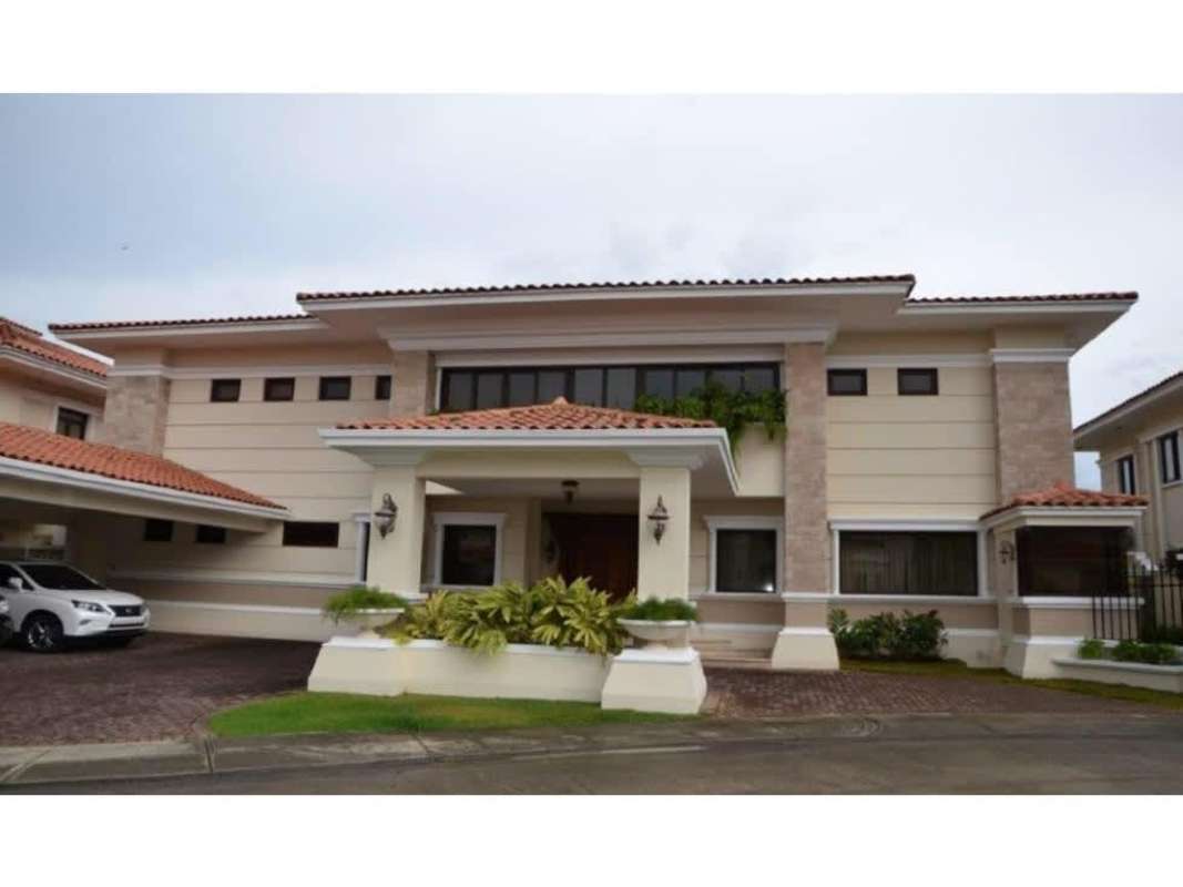 Elegant entrance foyer with marble stairs, ornate railing in Camelias Costa del Este Panama luxury house for rent