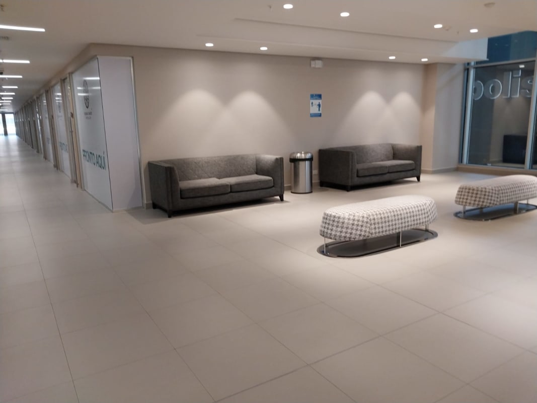 Industrial style unfinished commercial office corner with floor-to-ceiling glass Town Center Costa del Este Panama