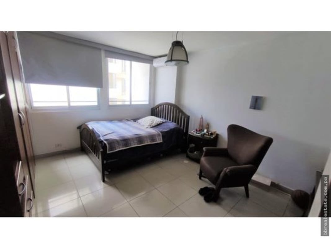 Bedroom with large window and city ocean view PH Vista del Sol Punta Paitilla Panama