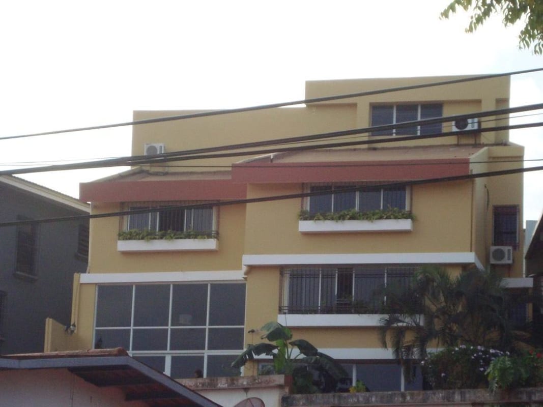 Bright dining room with imported tile floors and large barred windows in Villa de las Fuentes house for rent