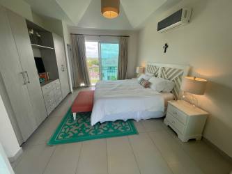 Bright master bedroom with vaulted ceiling, ocean view, balcony Quarry Heights Bijao