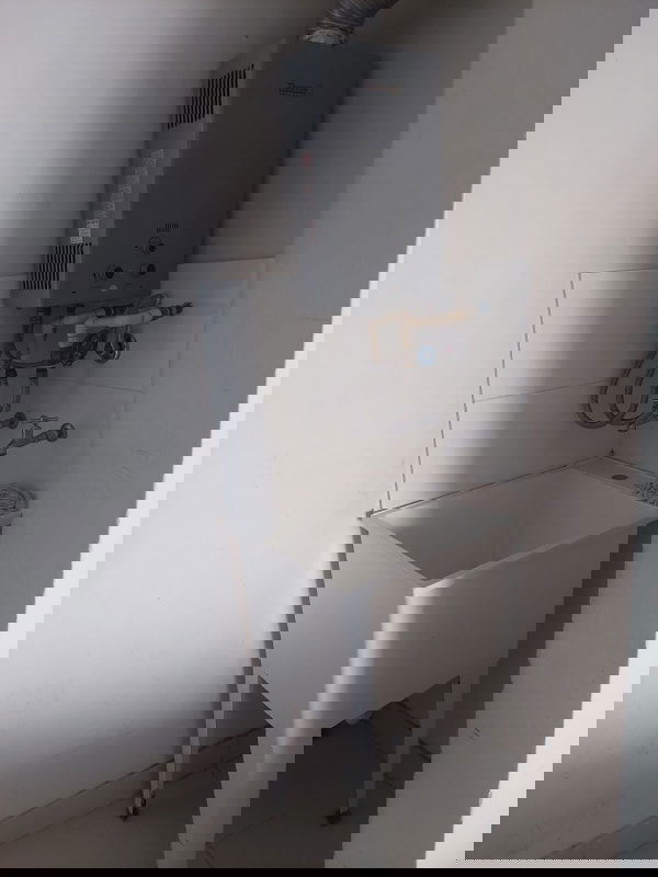 Laundry space with utility sink and gas heater PH Torre de Castilla Panama