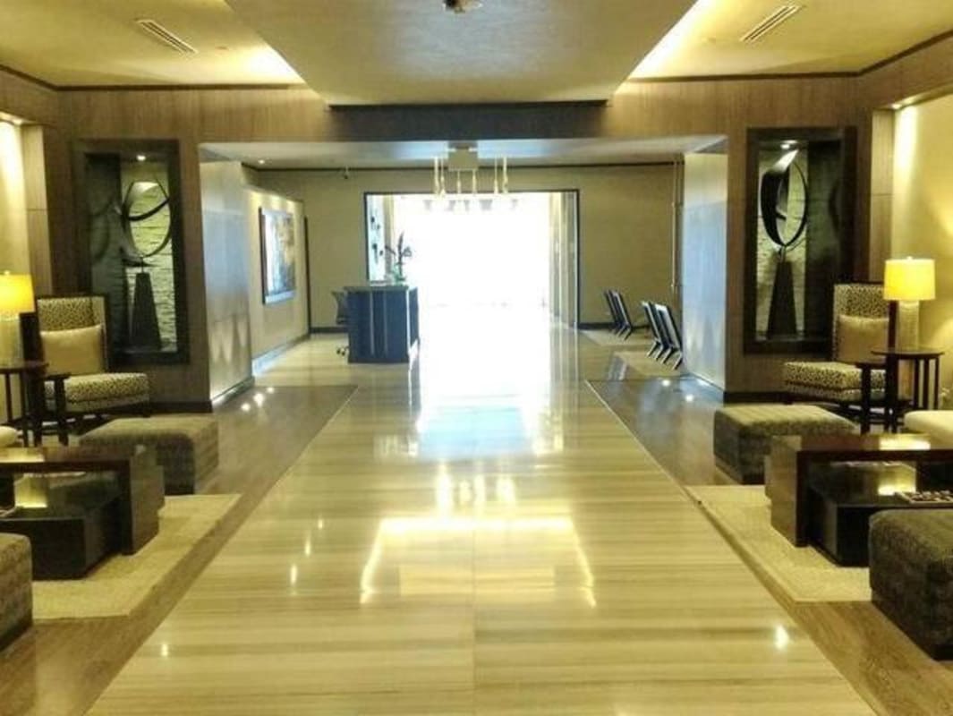 Elegant living room with marble floors and stunning ocean views Punta Pacifica luxury condo Panama