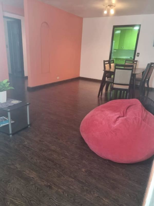 Bright living area with wooden floor and open plan in PH Altos del Chase Panama