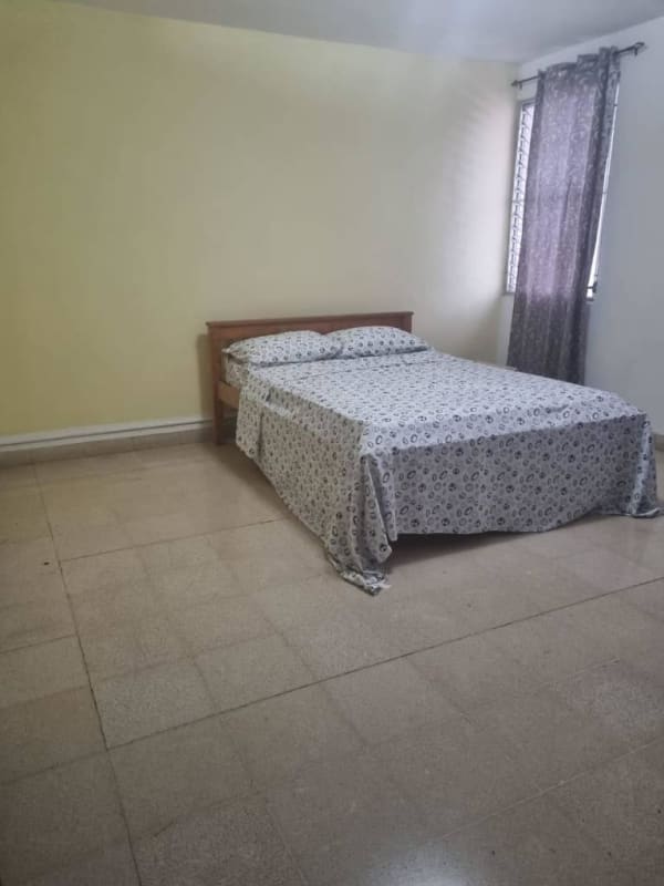 Bedroom with double bed and tiled floor in PH Altos del Chase El Cangrejo Panama