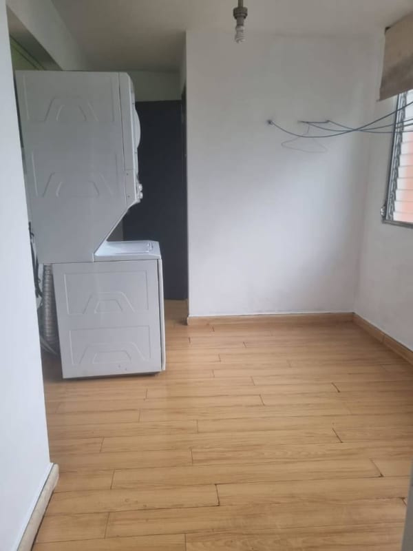 Laundry with washer dryer and large ventilation window in PH Altos del Chase