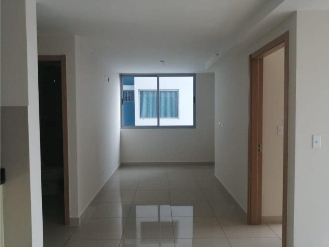 Bright living room with large windows tile floor balcony door PH Torres de Castilla