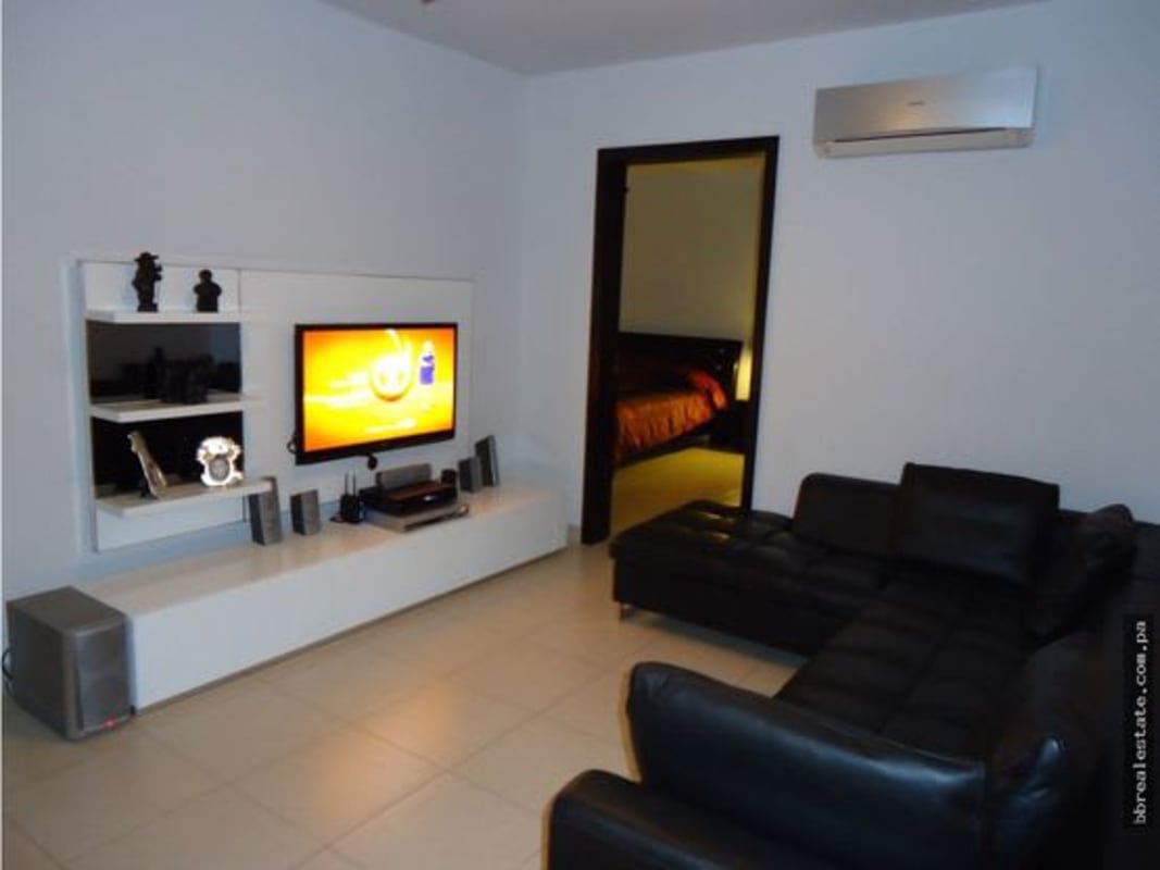 Modern outdoor pool area lounge chairs skyline view PH Tao San Francisco Panama