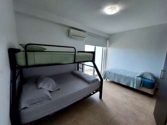 View of Playa Blanca resort swimming pools from apartment balcony Panama