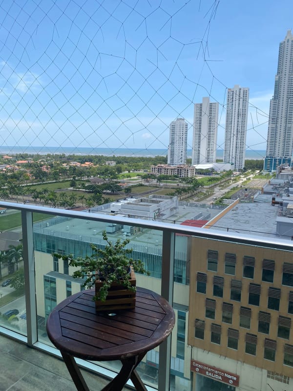 Master bedroom featuring large balcony window and city views PH Latitude Costa del Este Panama