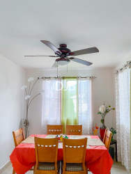 Bedroom furnished with AC, fan, bed, curtains in PH Las Olas Playa Dorada Panama