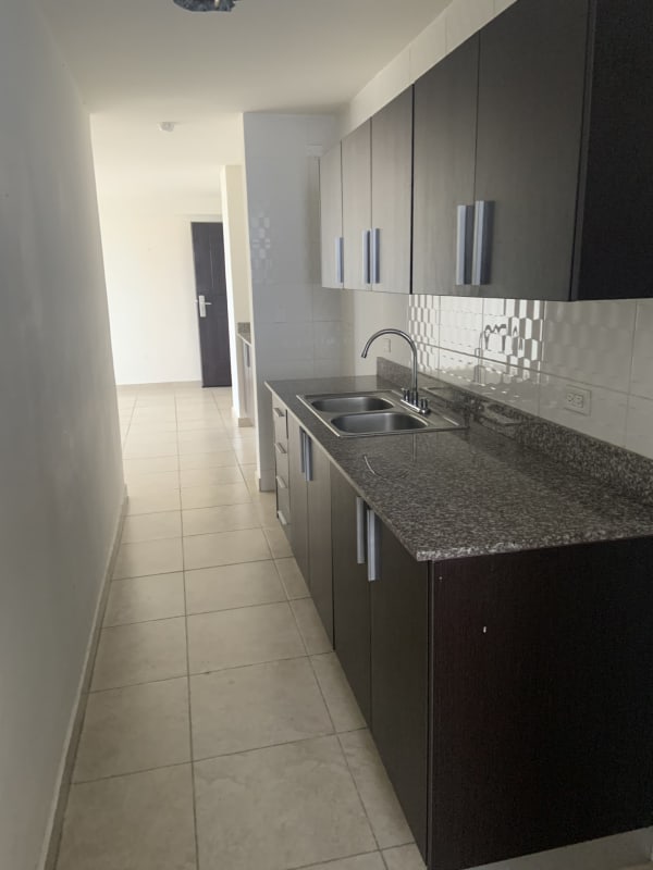 Bedroom with large window, mirrored closet, tiled floors in PH Vista Verde Tower Panama