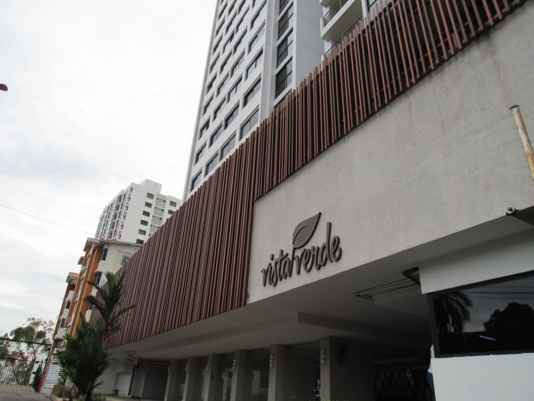 City view from balcony with railing in PH Vista Verde Tower Panama City apartment