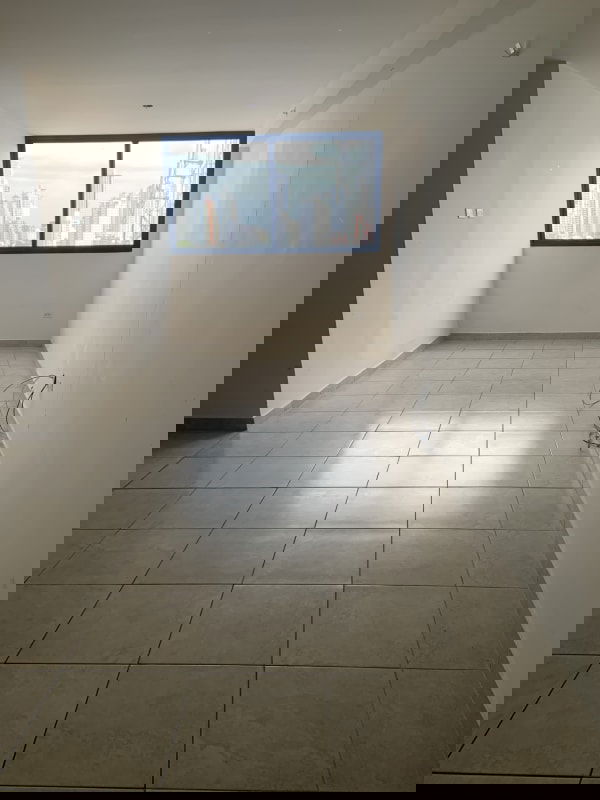 Spacious living area with large window and ceramic floor in PH Vista Verde Tower Panama City