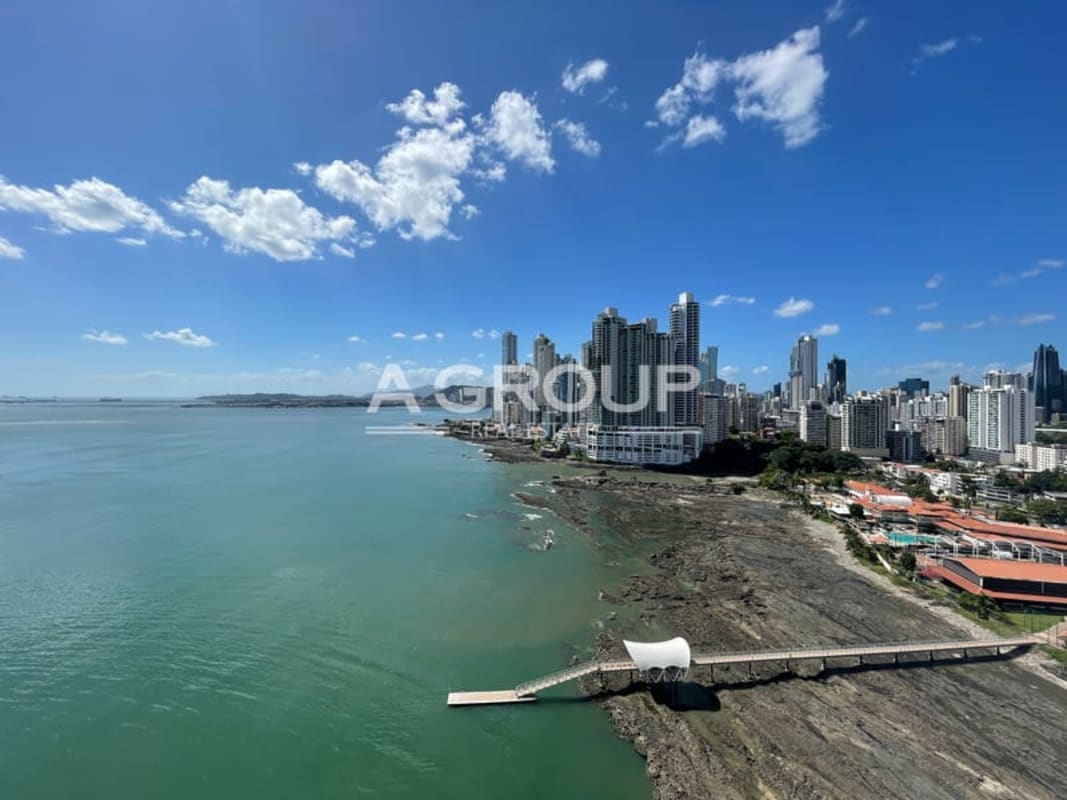 Large balcony with glass railings and Pacific ocean views at PH Bahia Pacifica Punta Pacifica Panama