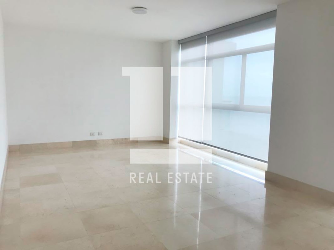 Modern glass and orange-accented facade of PH Paramount luxury condominium in Costa del Este Panama