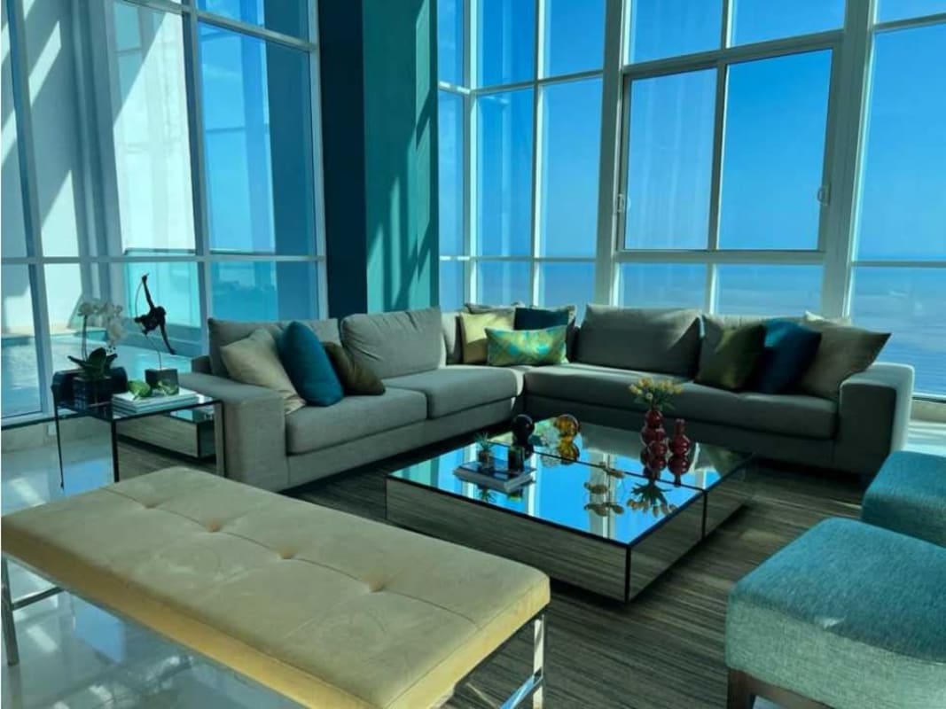 Modern double-height ceiling living room with marble floors and full ocean view in PH Vitri Costa del Este Panama