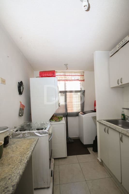 Open plan living dining with tile floors blue accent wall at PH Mystic Village Don Bosco