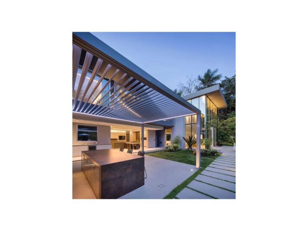 Covered patio with outdoor kitchen island and garden landscaping in Clayton Heights