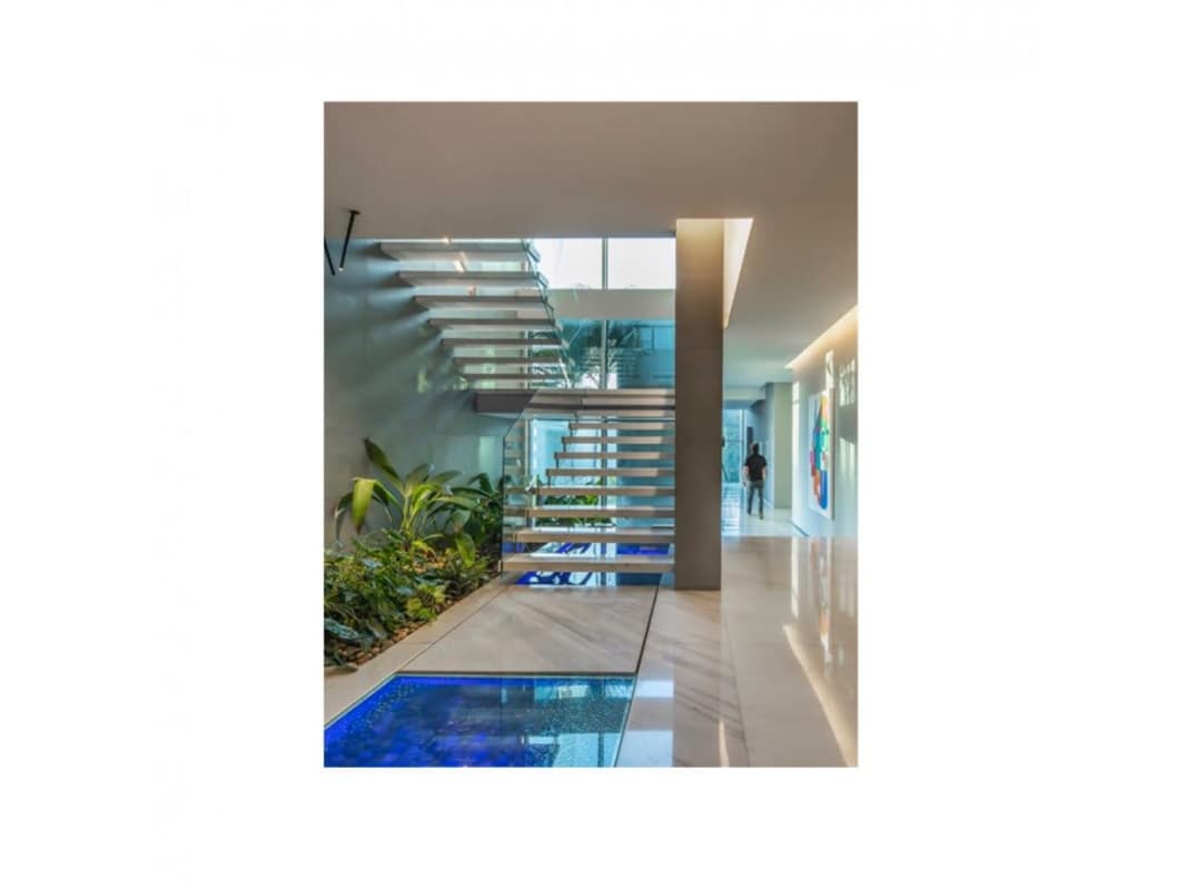 Luxury interior double-height ceiling living room with glass wine cellar in Panama