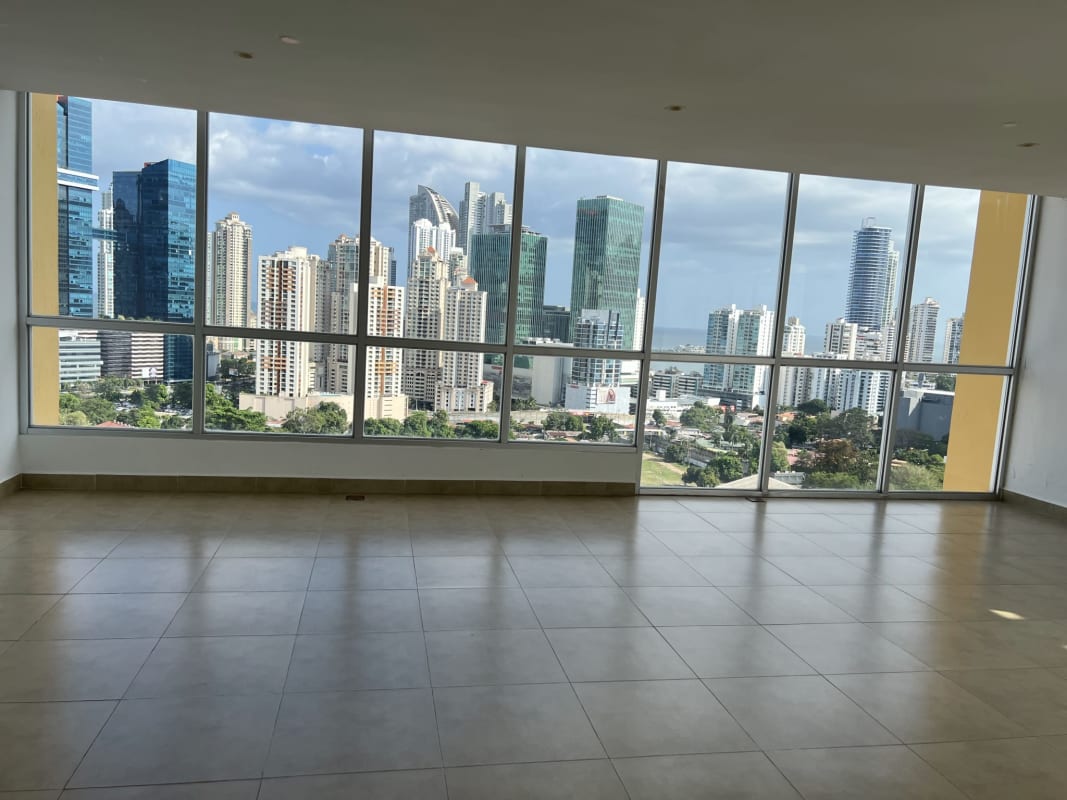 Rooftop swimming pool with glass railing and panoramic skyline view at PH The One Obarrio Panama City