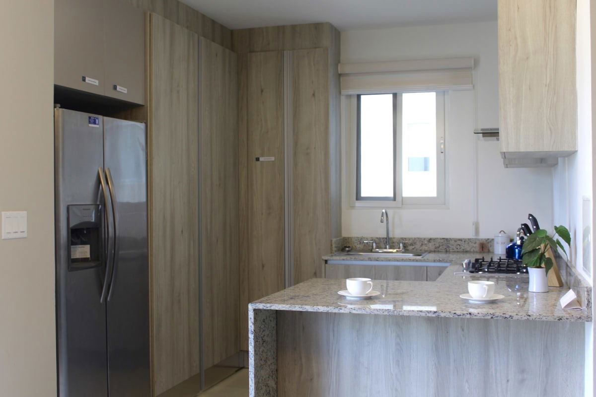 Contemporary homes with carports lush landscaping at PH Villasur Residences Costa Sur Panama