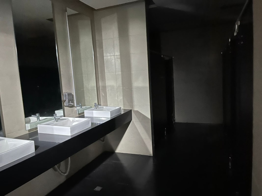 Restrooms with vessel sinks large mirrors partitioned stalls Victoriano Lorenzo San Miguelito Panama City