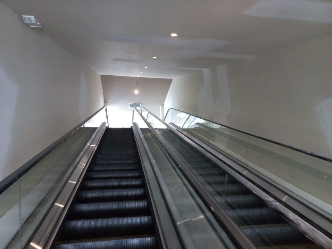 Facade with black awning signage area gate and street front commercial property in San Miguelito Panama