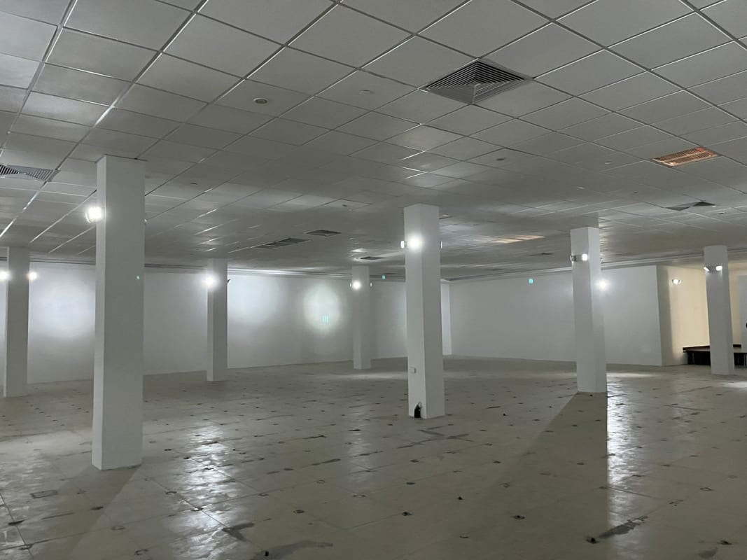 Indoor escalators glass railings beige walls inside El Fuerte shopping plaza Victoriano Lorenzo Panama