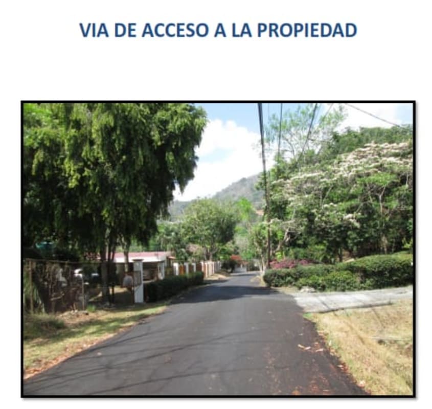 Paved road with greenery leading to large property lot in Las Lajas Las Cumbres Panama