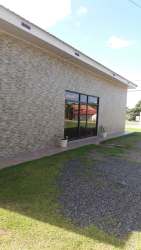 Reception or office area with large windows and tiled floors Coronado Panama