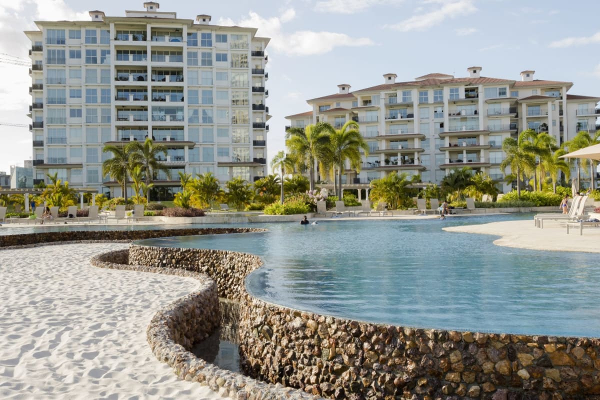 Elegant dining area with floor-to-ceiling windows overlooking golf and lakes at PH Pinnacle