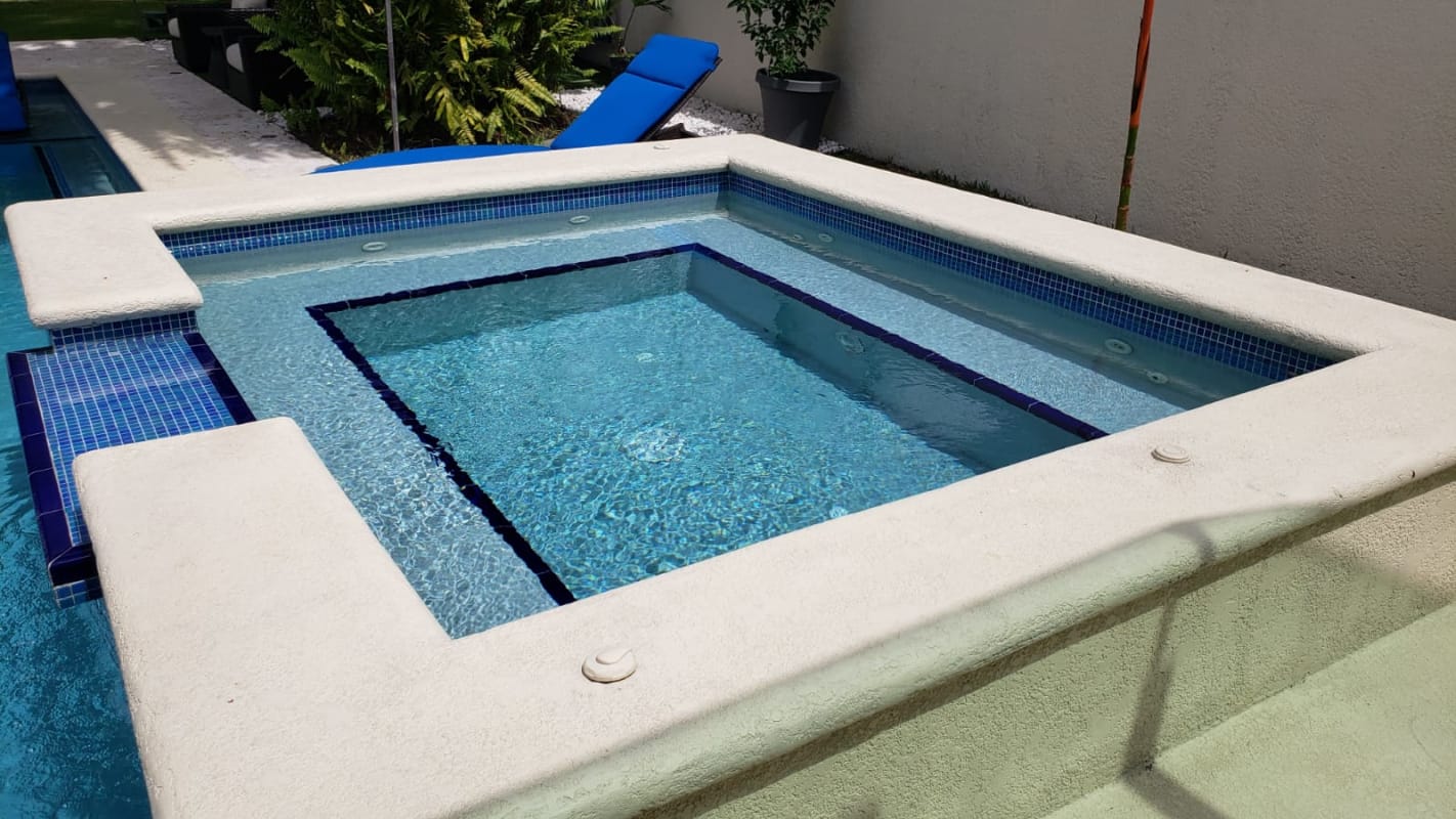Modern living room with glass doors to garden Costa del Este house Panama