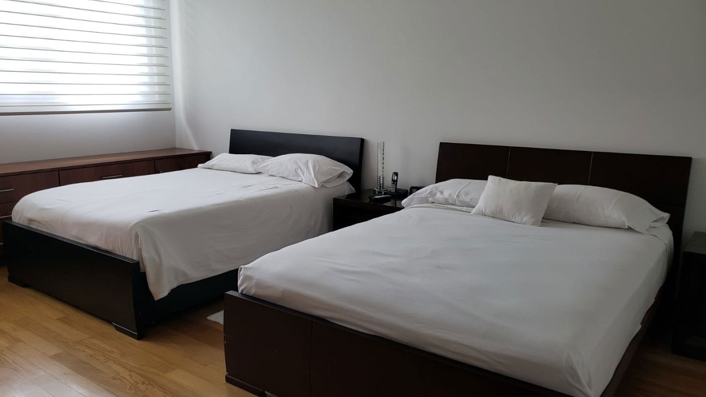 Spacious modern kitchen with granite island and stainless appliances Costa del Este full view