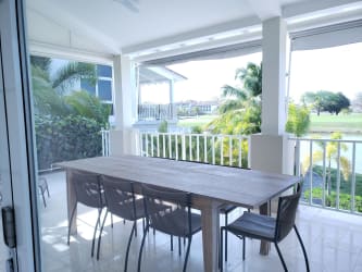 Spacious modern bathroom with glass-enclosed shower, bathtub, and elegant finishes in Buenaventura Golf Resort Panama