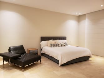 Modern bathroom with freestanding tub and frosted glass shower in luxury Buenaventura resort home