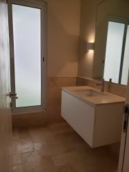 Spacious dining area with wood furniture and pendant lights at Buenaventura Resort Panama rental