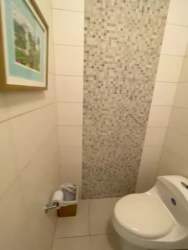 Guest bedroom with ensuite bathroom at Bijao Beach Resort Panama Condo Rental