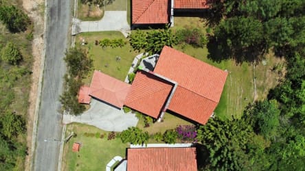 Open plan living area with tile floors stone accent wall and mountain view terrace in Granada Altos del María Panama
